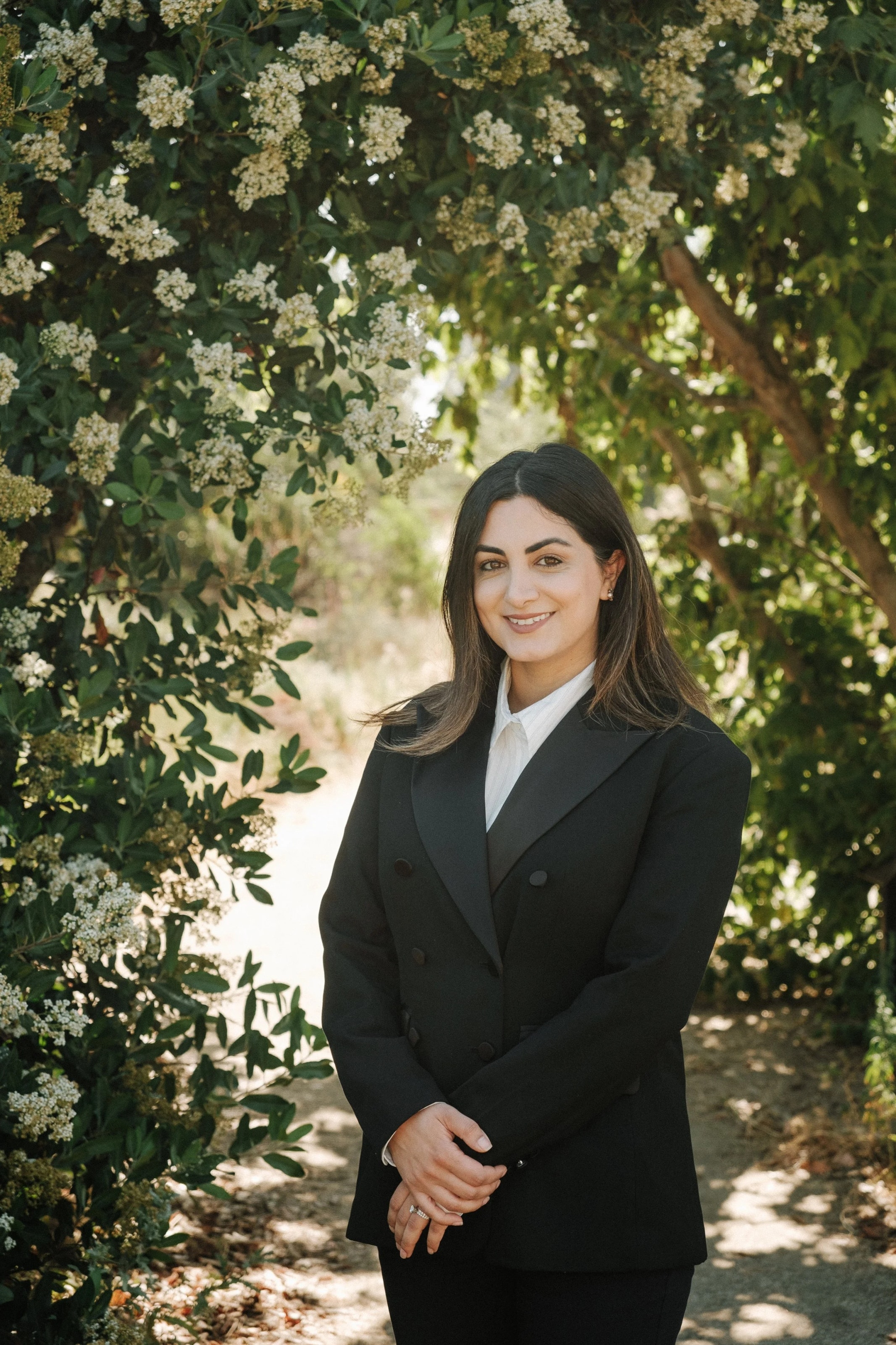 Outdoor brand portrait among blossoms