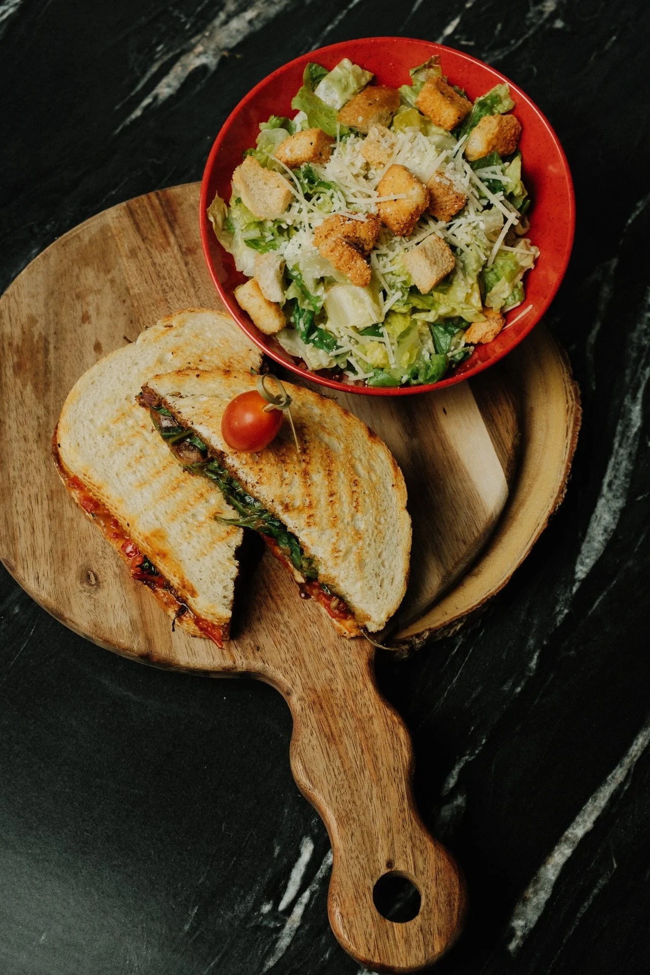 Grilled sandwich and Caesar salad still life
