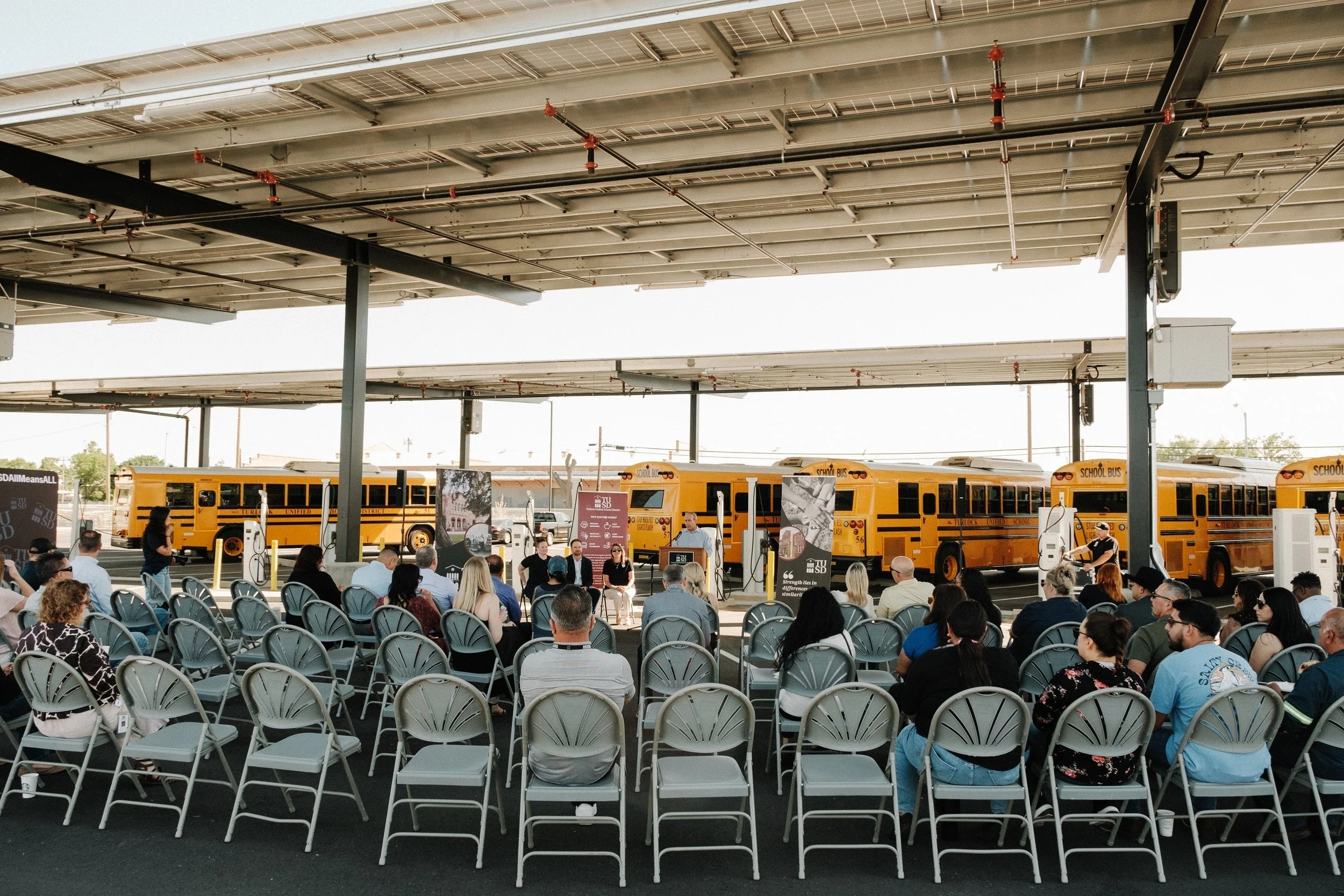 Turlock Unified ceremony under the bus canopy