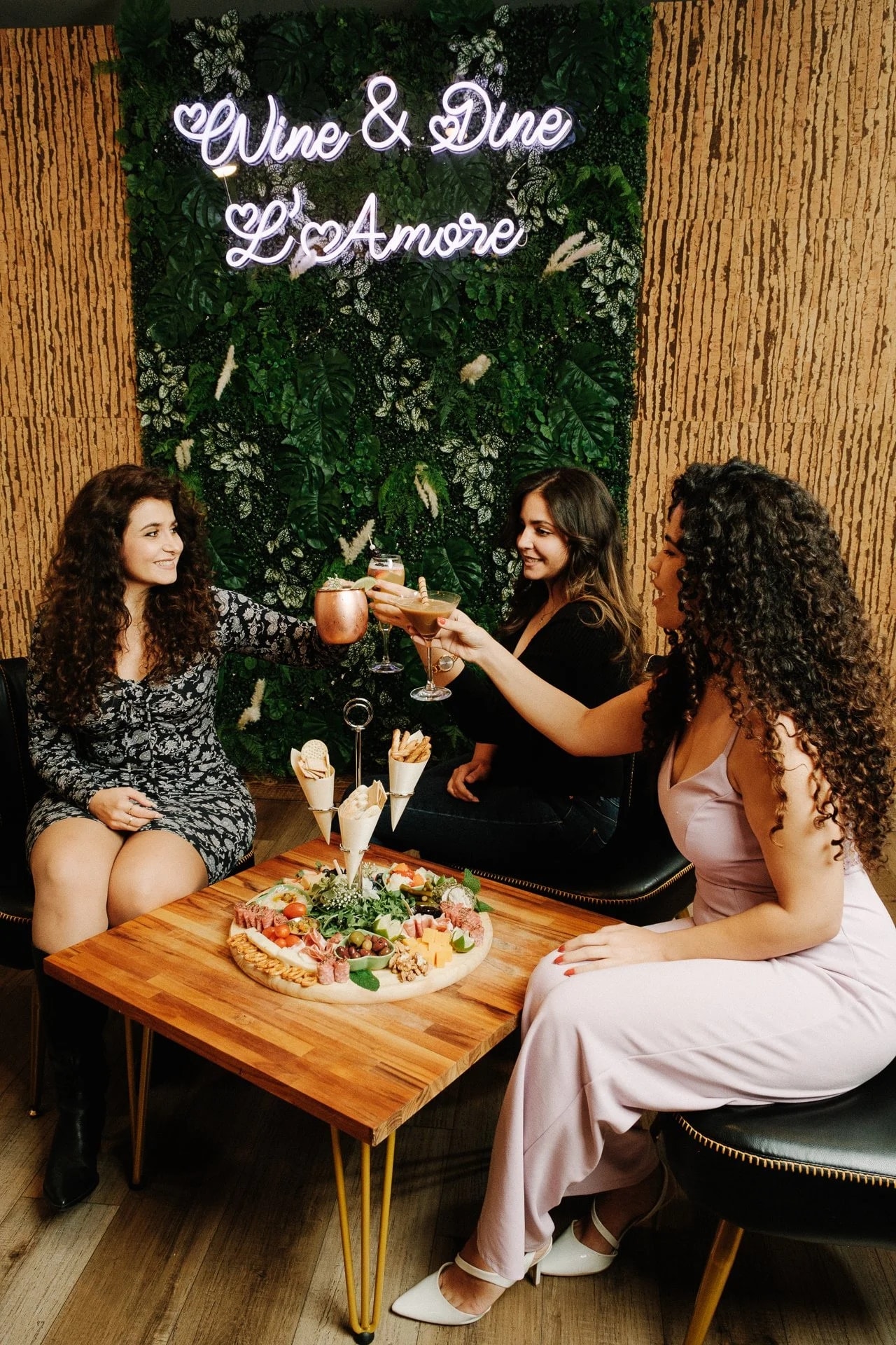 Friends toasting at Wine & Dine L'Amore